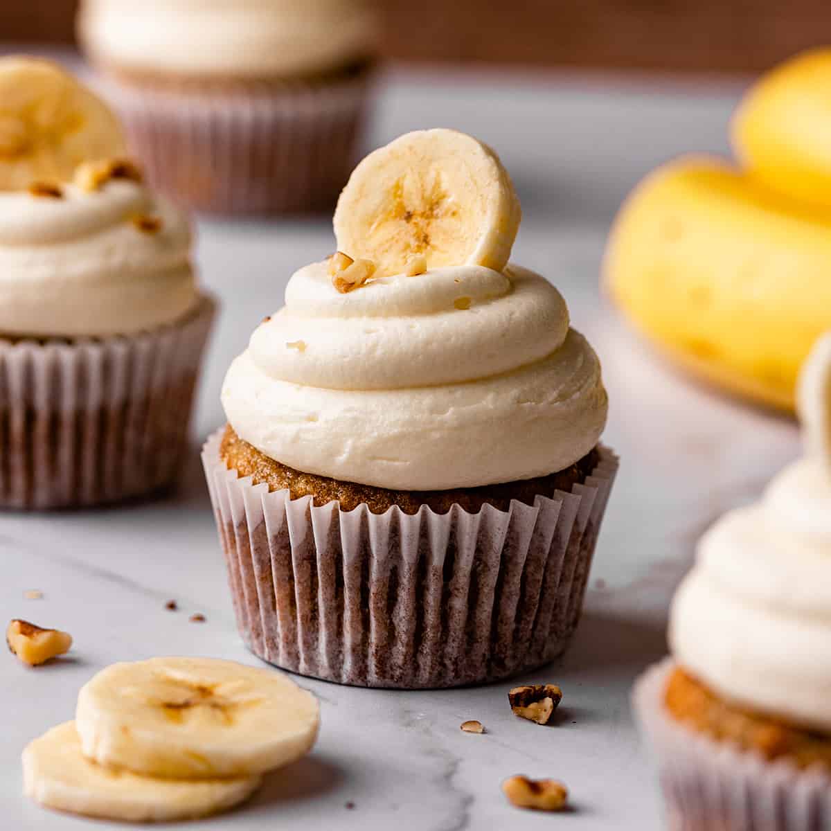 three Banana Cupcakes with frosting
