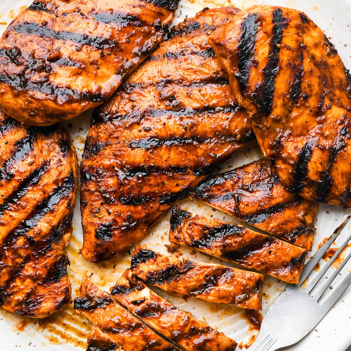 5 grilled bbq chicken breasts, one cut into slices