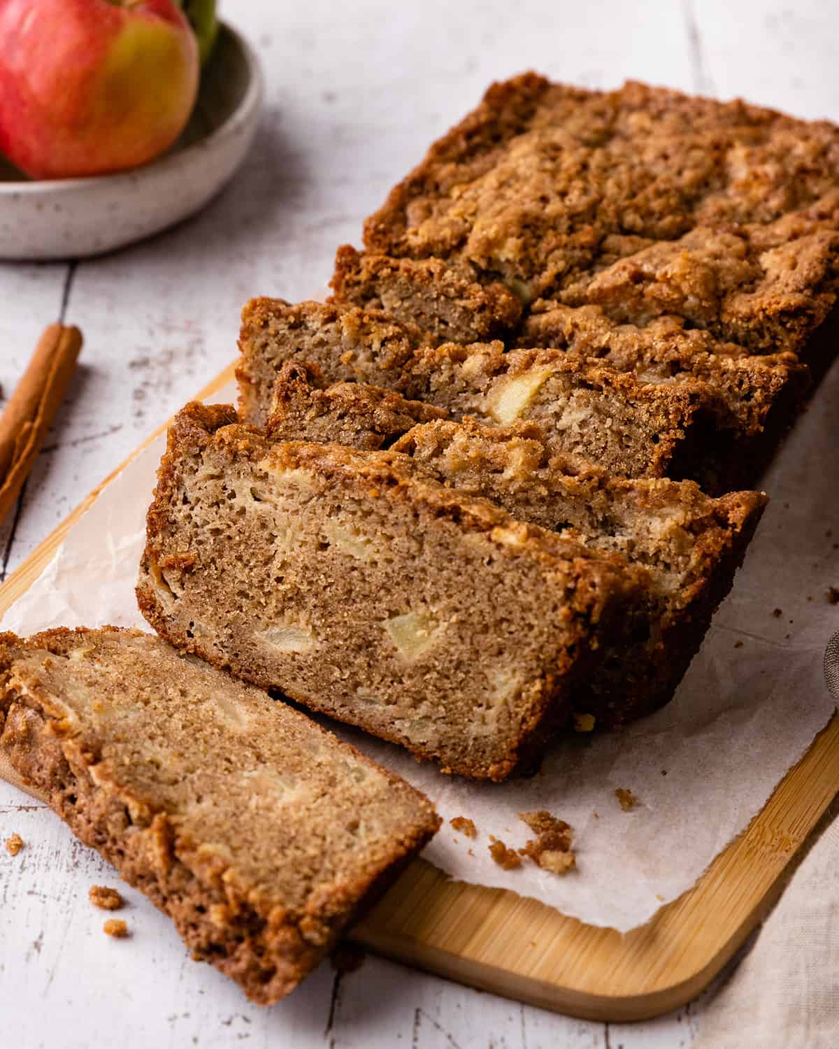 a loaf of Cinnamon Apple Bread with 5 slices cut out of it