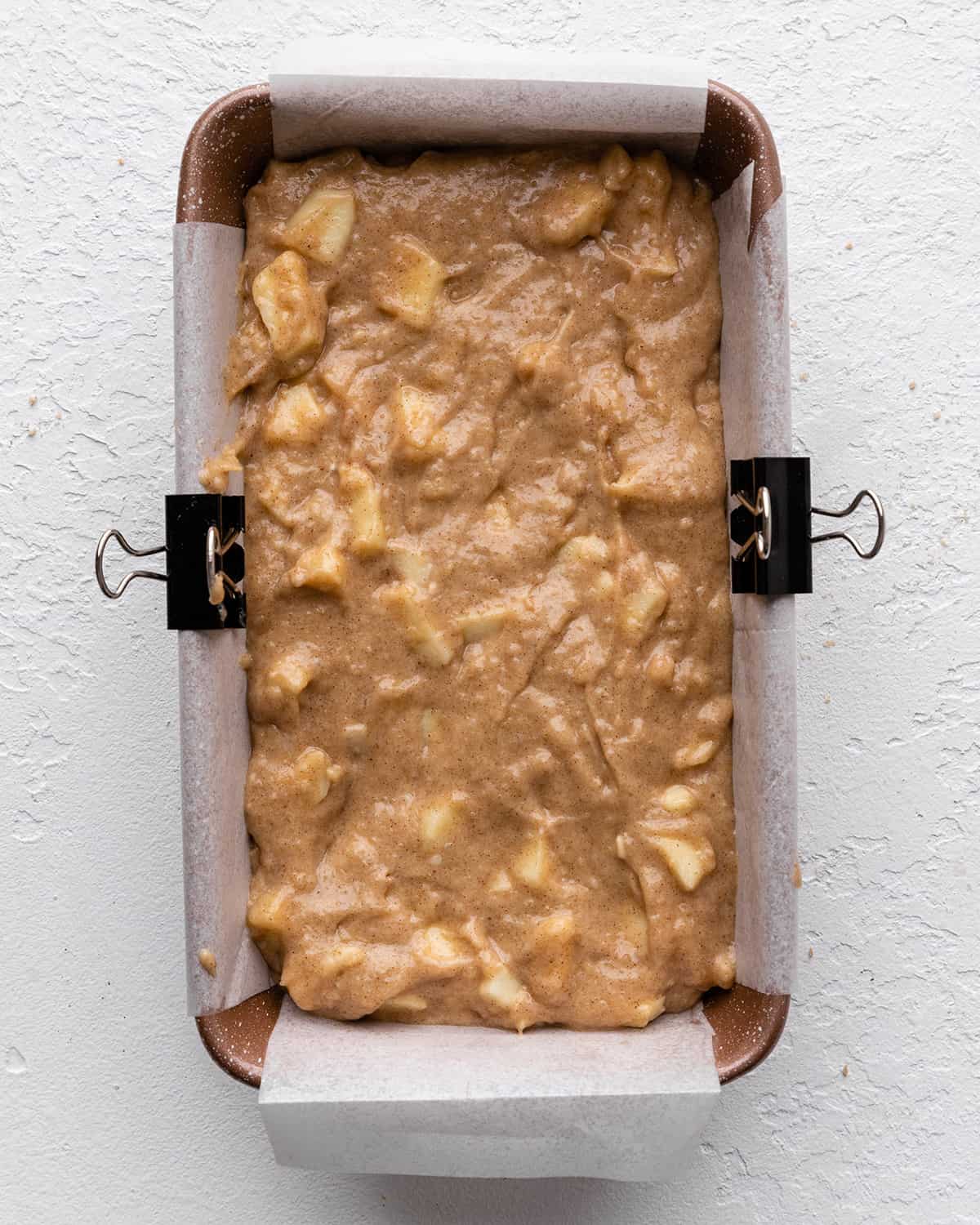 cinnamon apple bread in a baking pan before baking