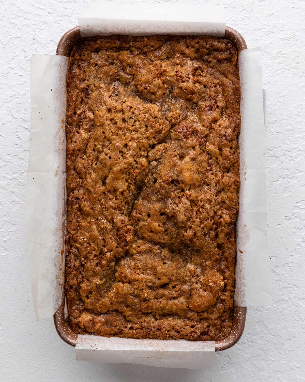 cinnamon apple bread in a baking pan after baking