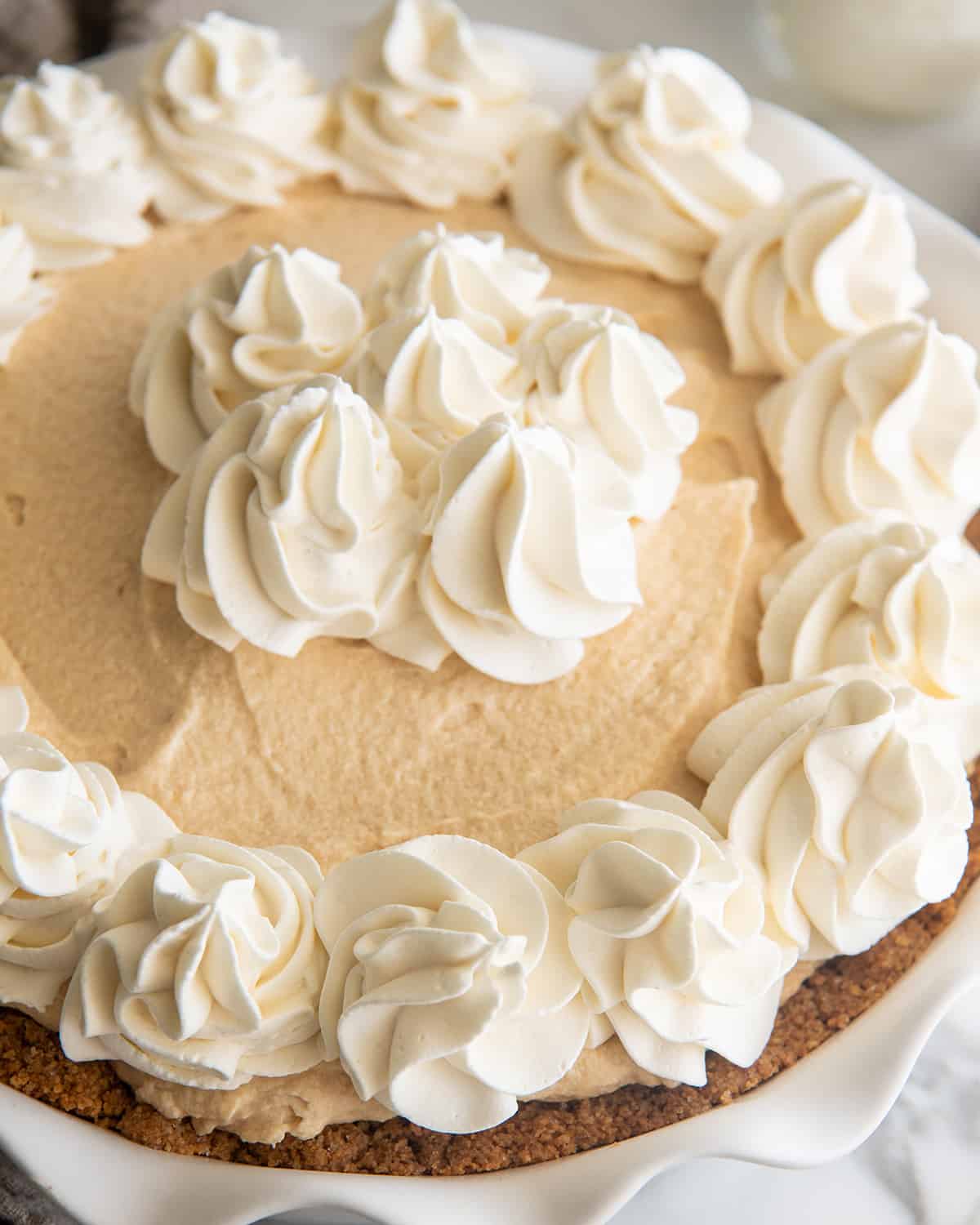 No-Bake Peanut Butter Pie topped with whipped cream