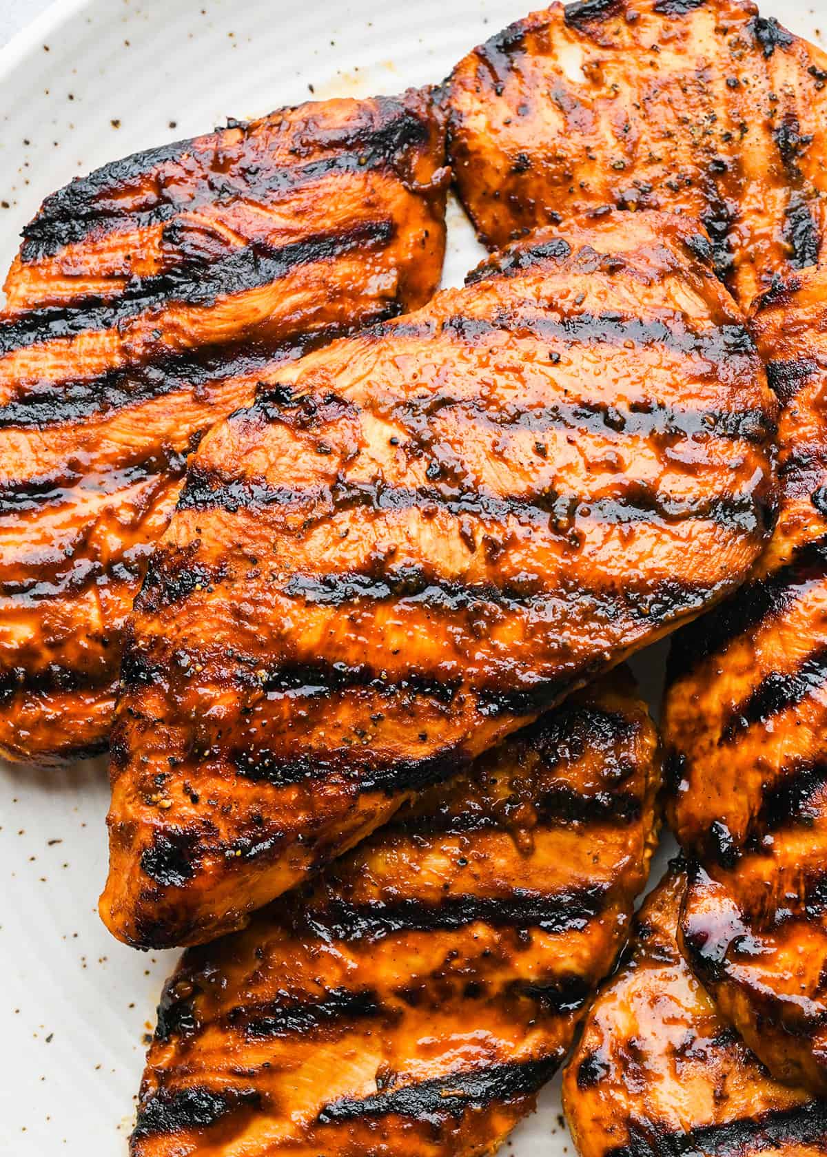 How to Make BBQ Chicken - 5 grilled bbq chicken breasts on a plate