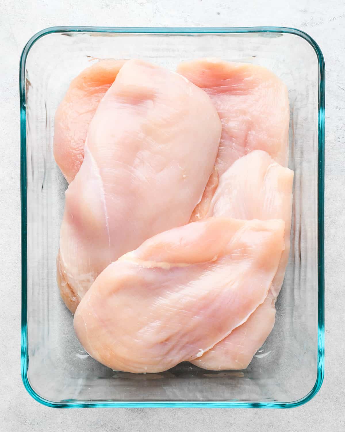 How to Make BBQ Chicken - chicken breasts in a glass contianer