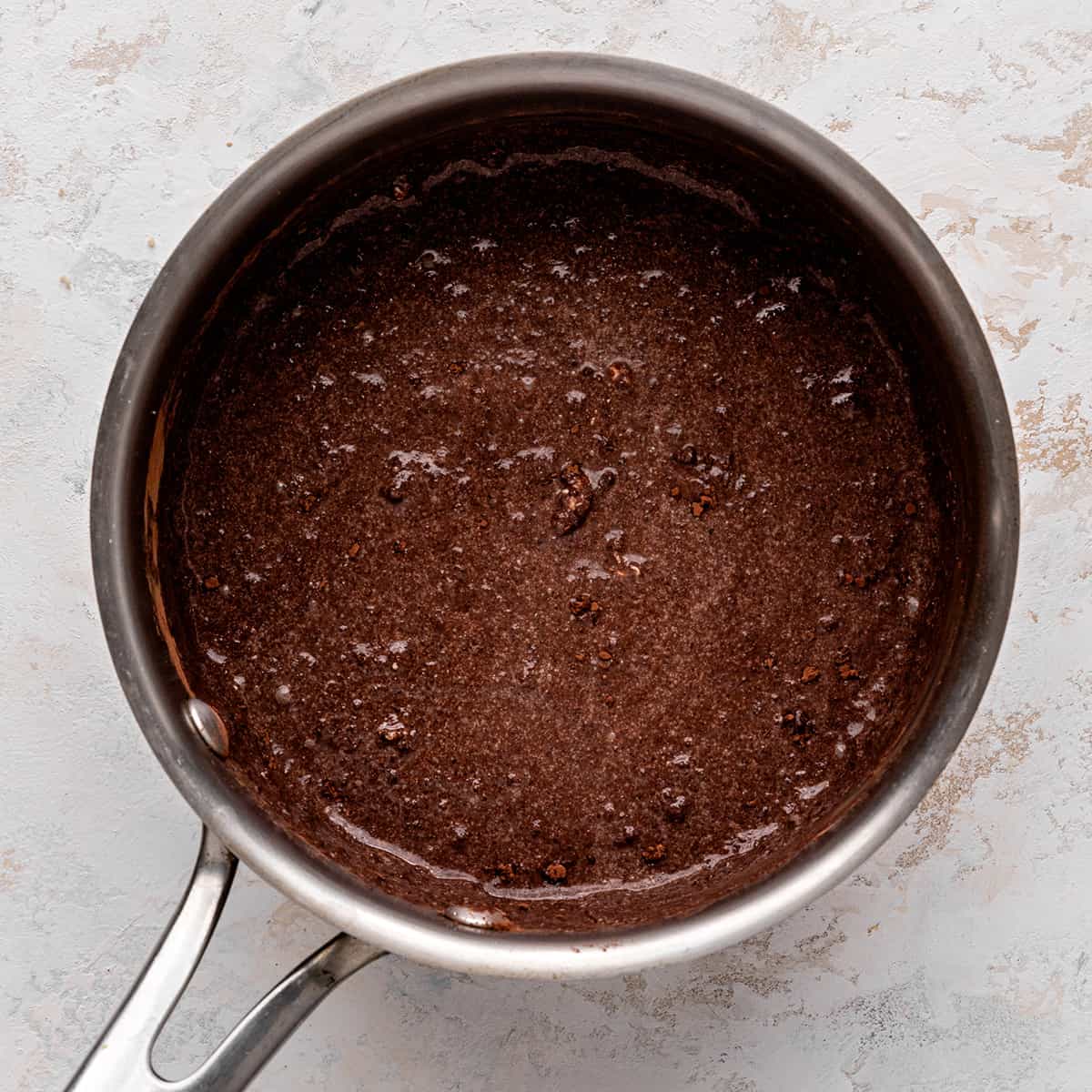 How to Make Chocolate Sauce - ingredients combined and melted in a saucepan