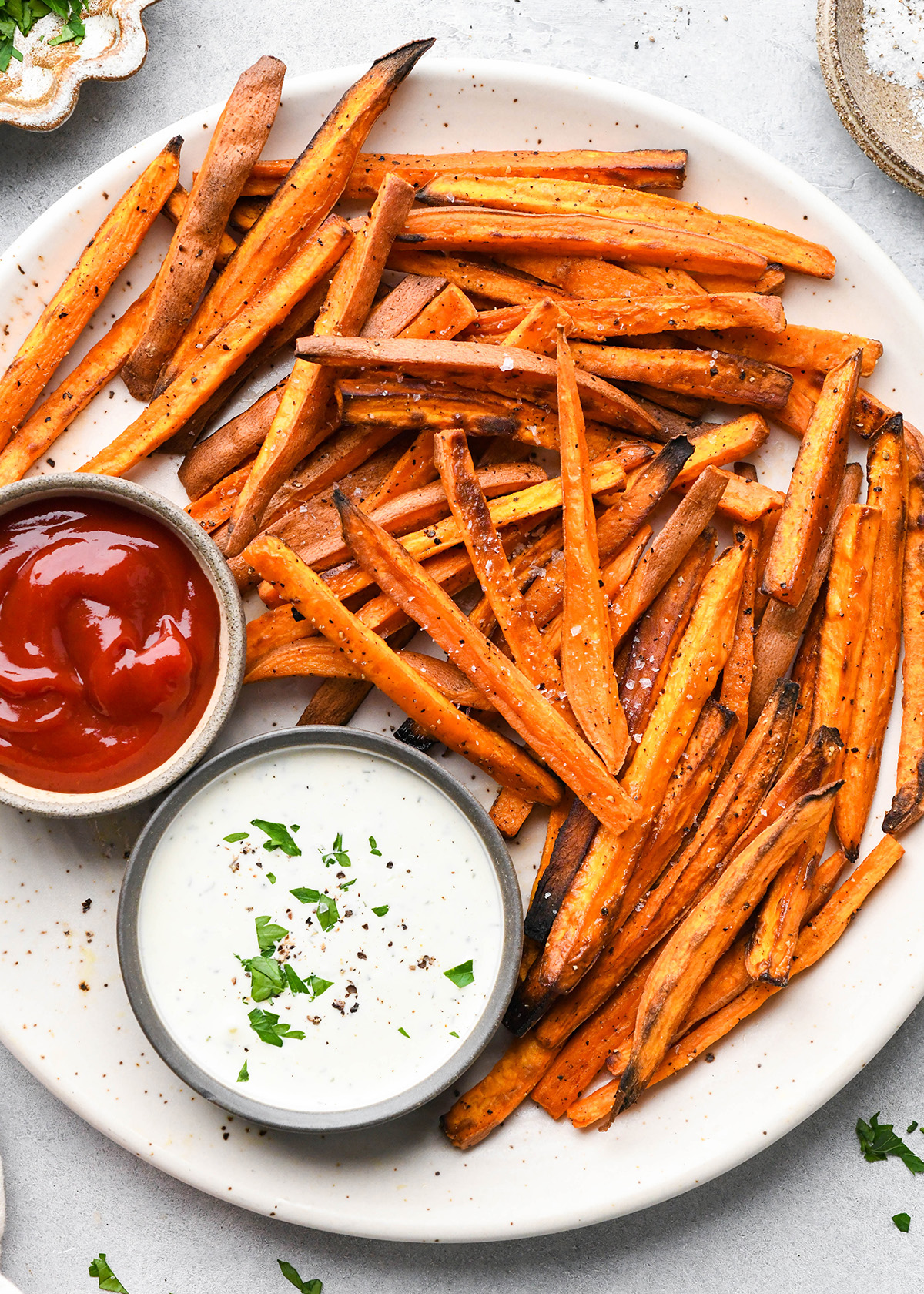 Baked Sweet Potato Fries on a plate with two dipping sauces