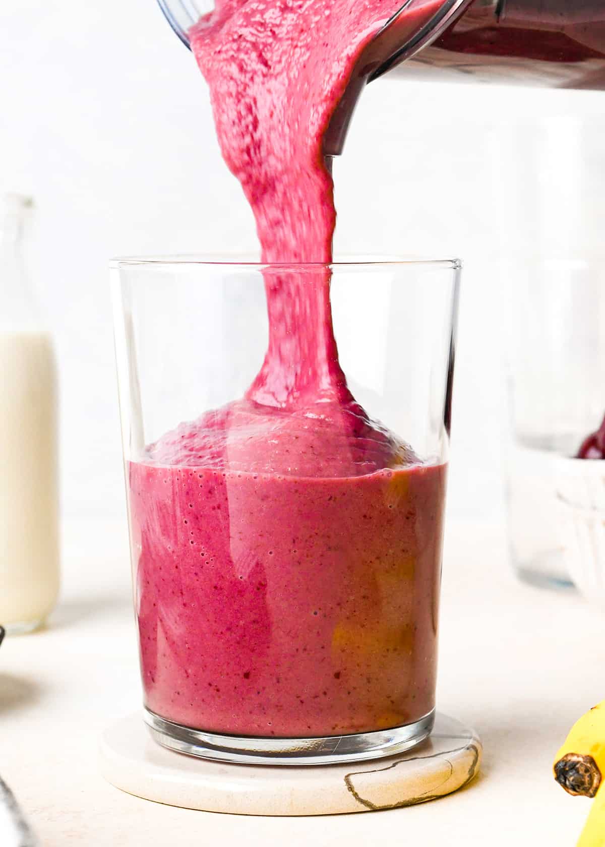 Cherry Smoothie being poured into a glass