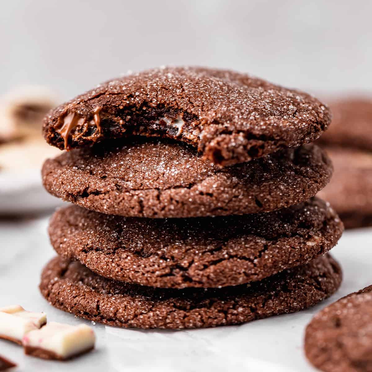 a stack of 4 Chocolate Peppermint Cookies, the top one with a bite taken out