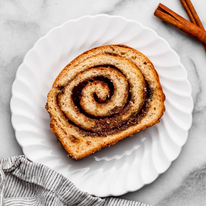 one slice of Cinnamon Swirl Bread on a white plate