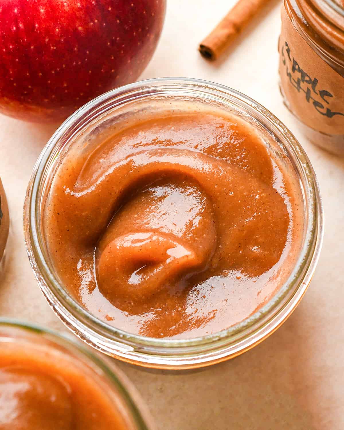 overhead photo of Homemade Apple Butter in a glass jar