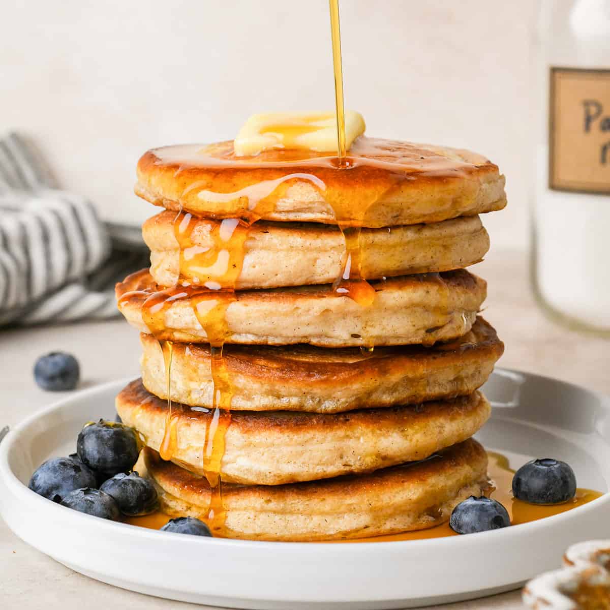 stack of 6 pancakes made with Homemade Pancake Mix topped with butter and syrup