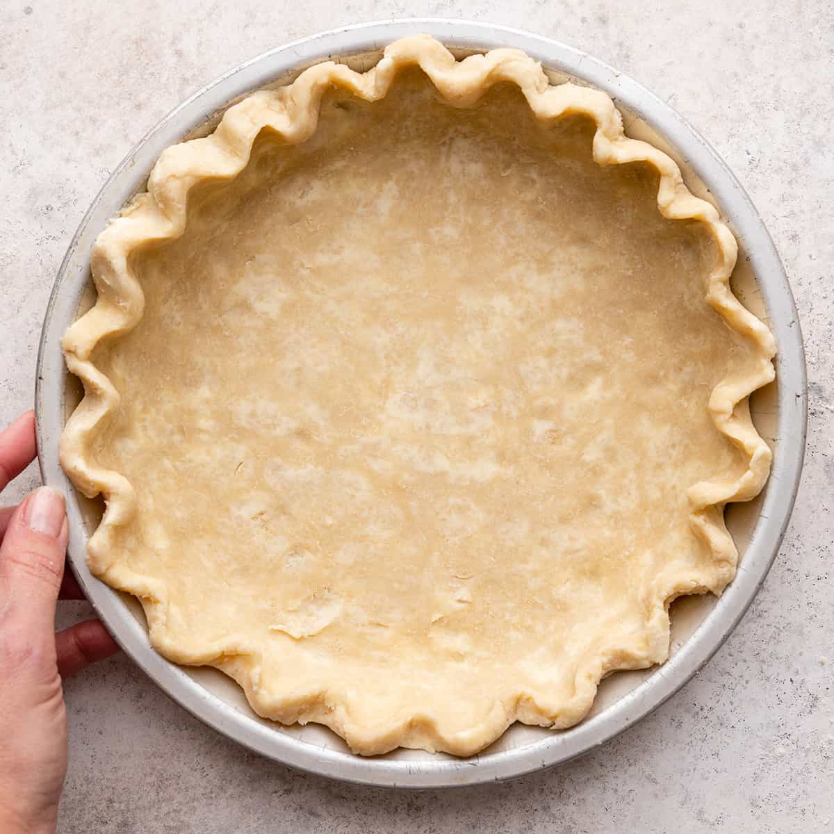 pie crust formed in a pie dish to make Brownie Pie
