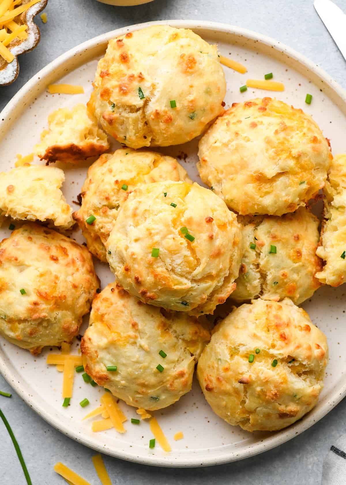 9 cheese biscuits on a plate