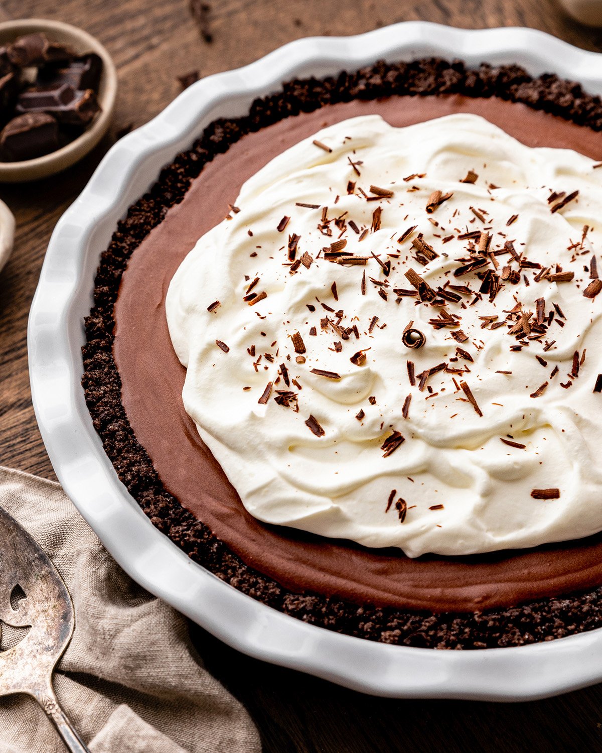 Chocolate Pudding Pie with whipped cream and chocolate shavings 