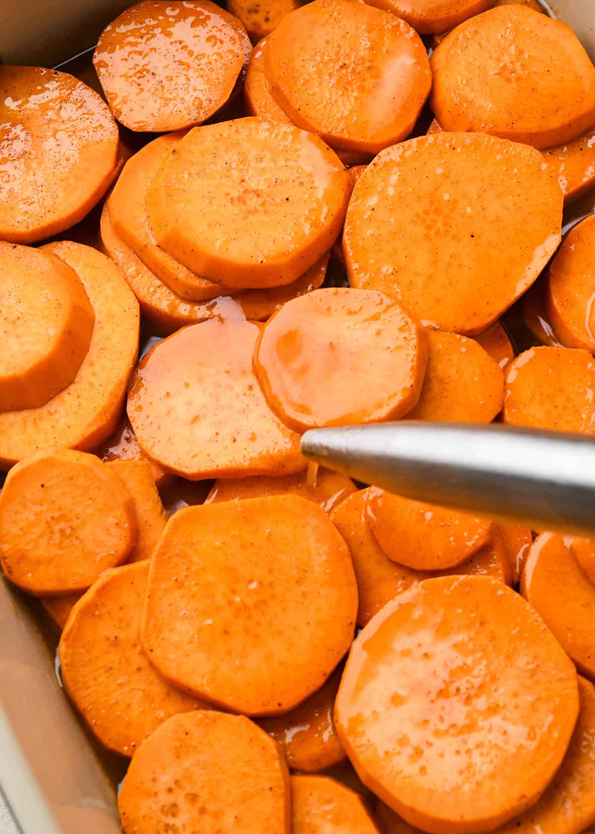 How to Make Candied Yams - basting partially baked yams with the sauce