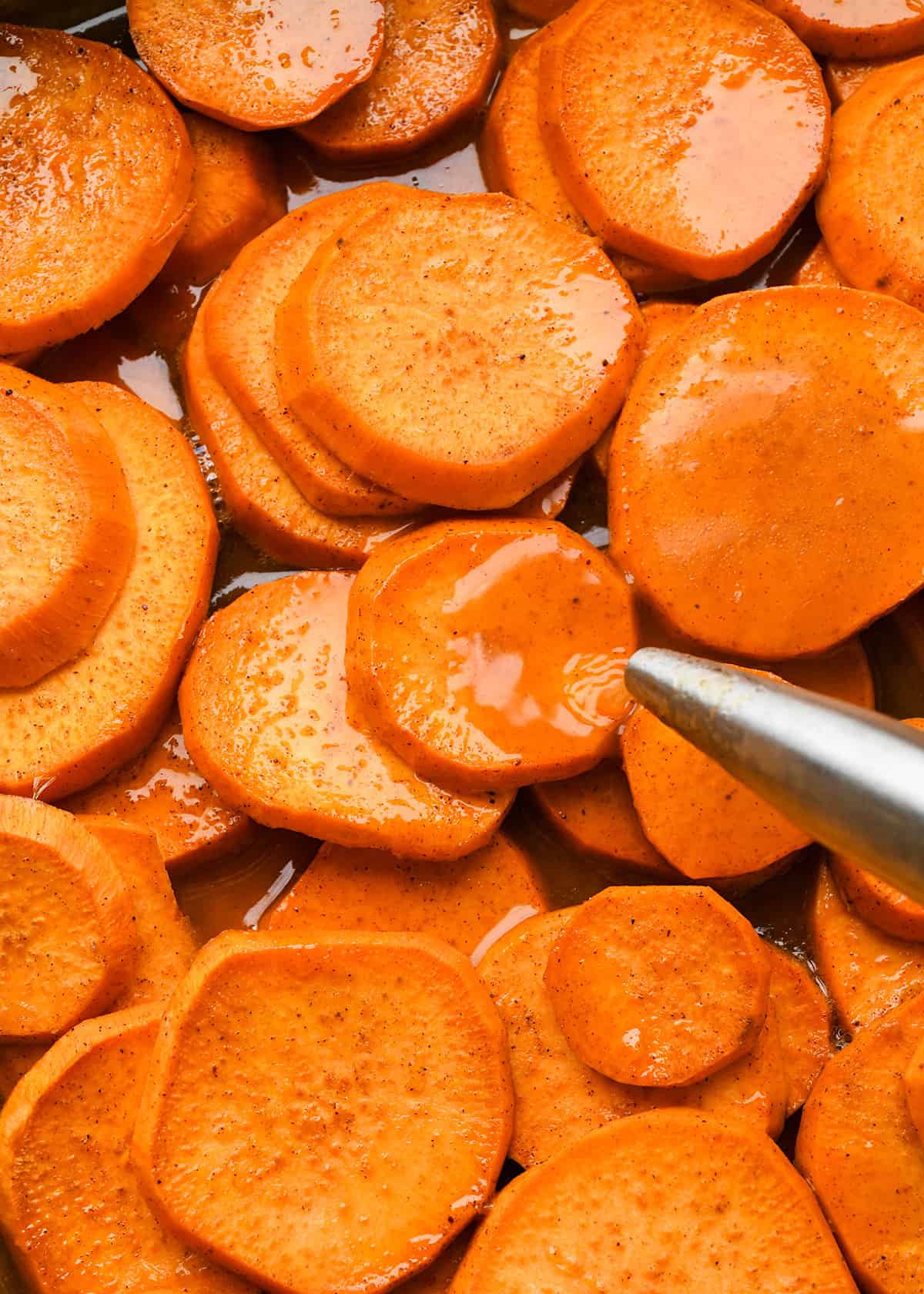 How to Make Candied Yams - basting partially baked yams with the sauce