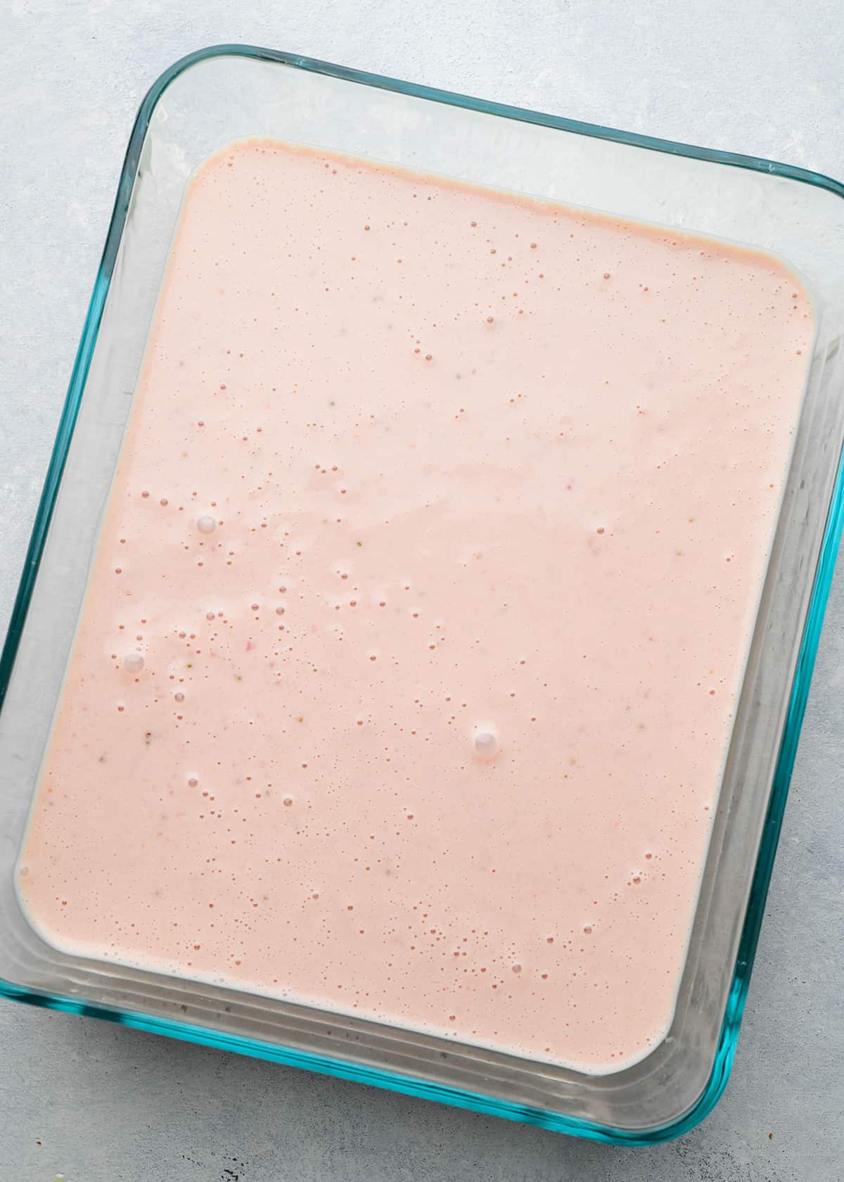 strawberry ice cream mixture in a glass container 