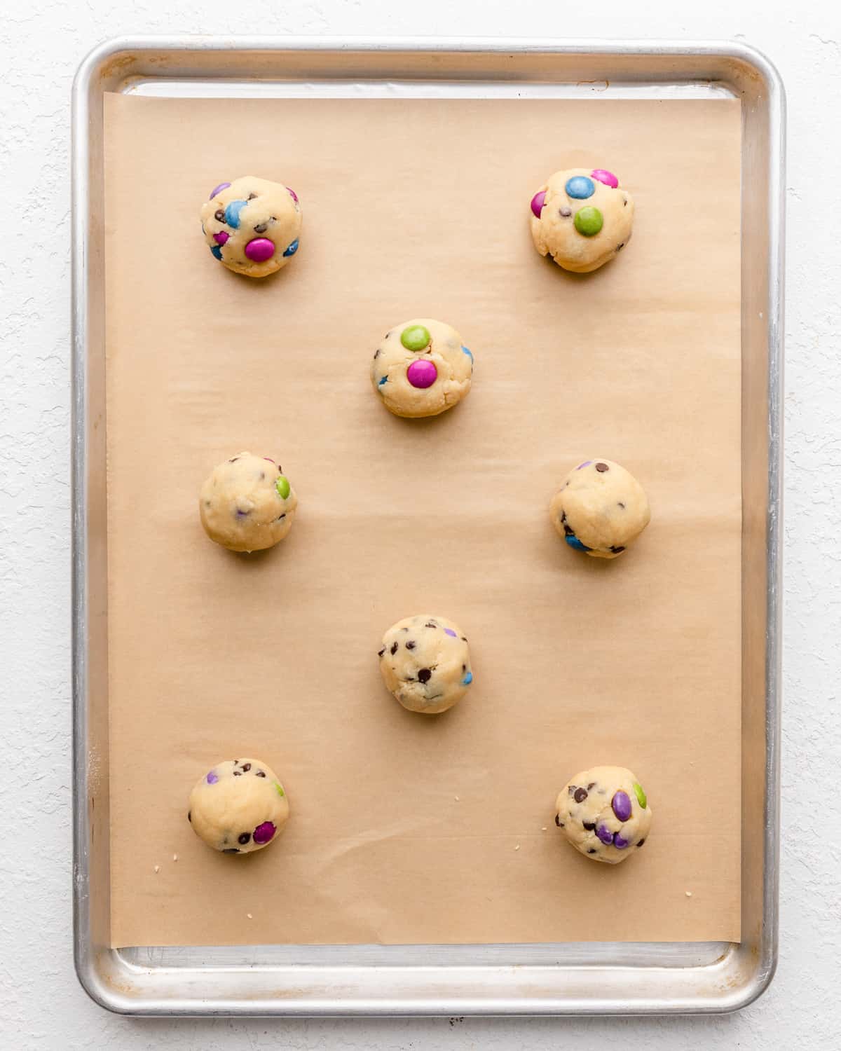 M & M cookies on a baking sheet before baking