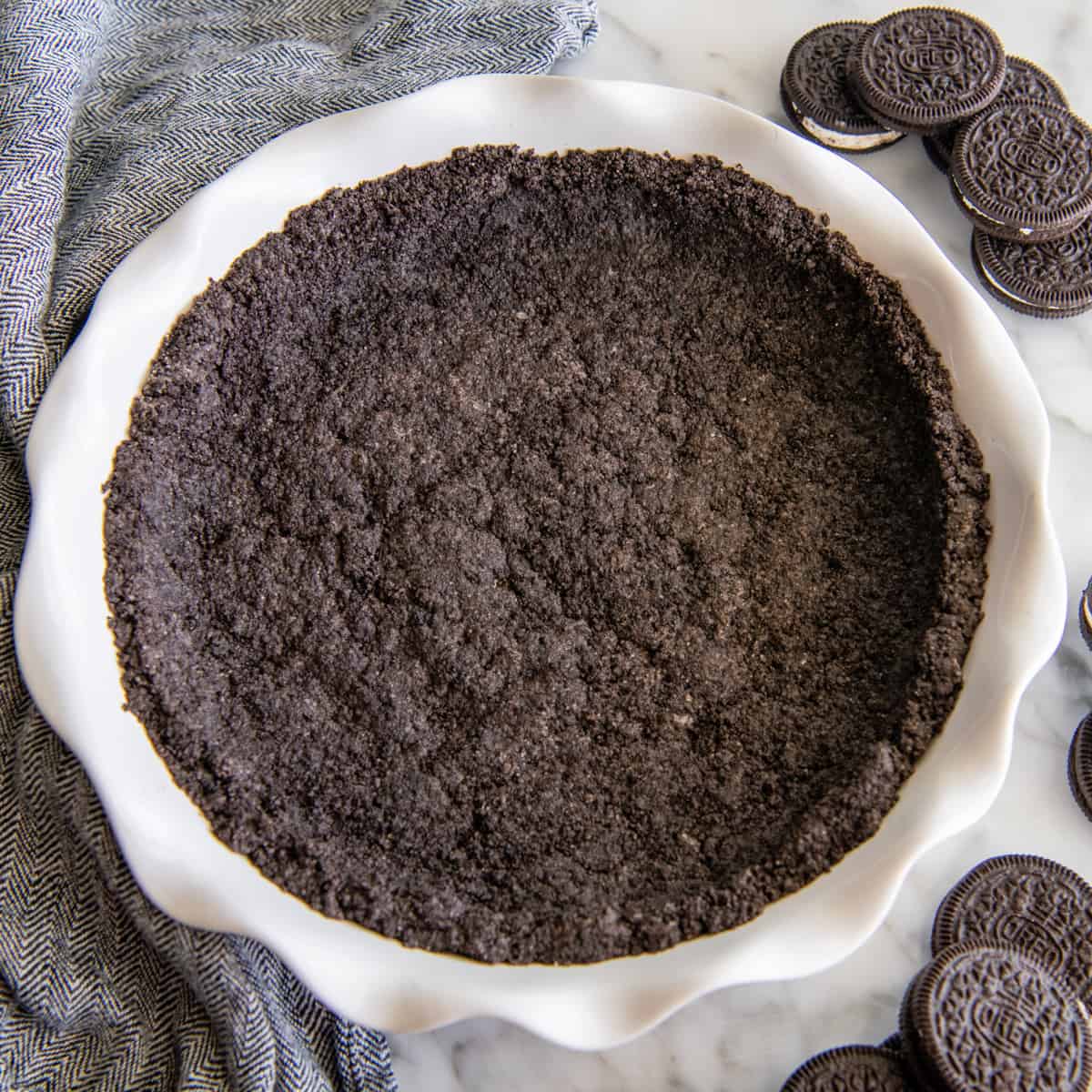 oreo crust baked in a white pie dish