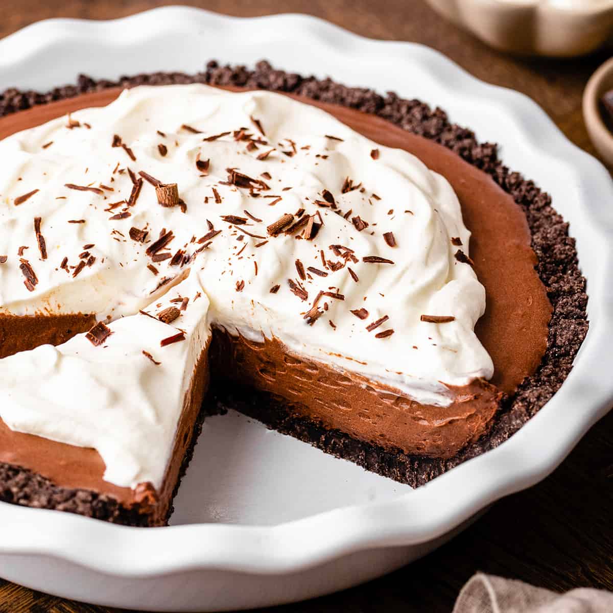 Oreo crust being used for a chocolate pudding pie
