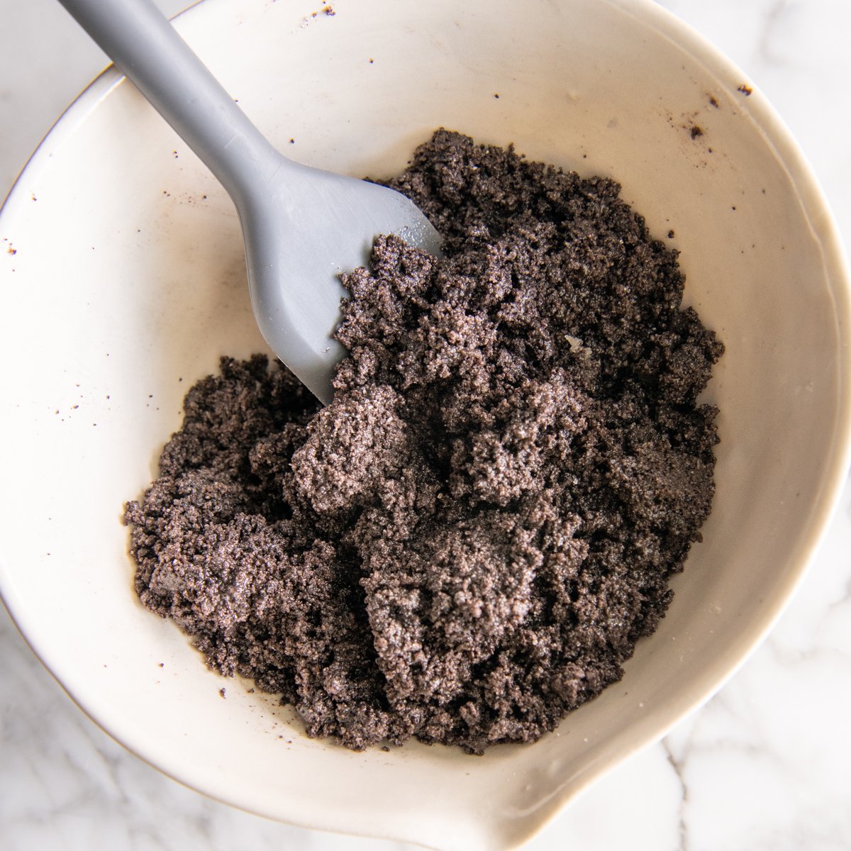 Oreo Pie Crust mixture in a mixing bowl
