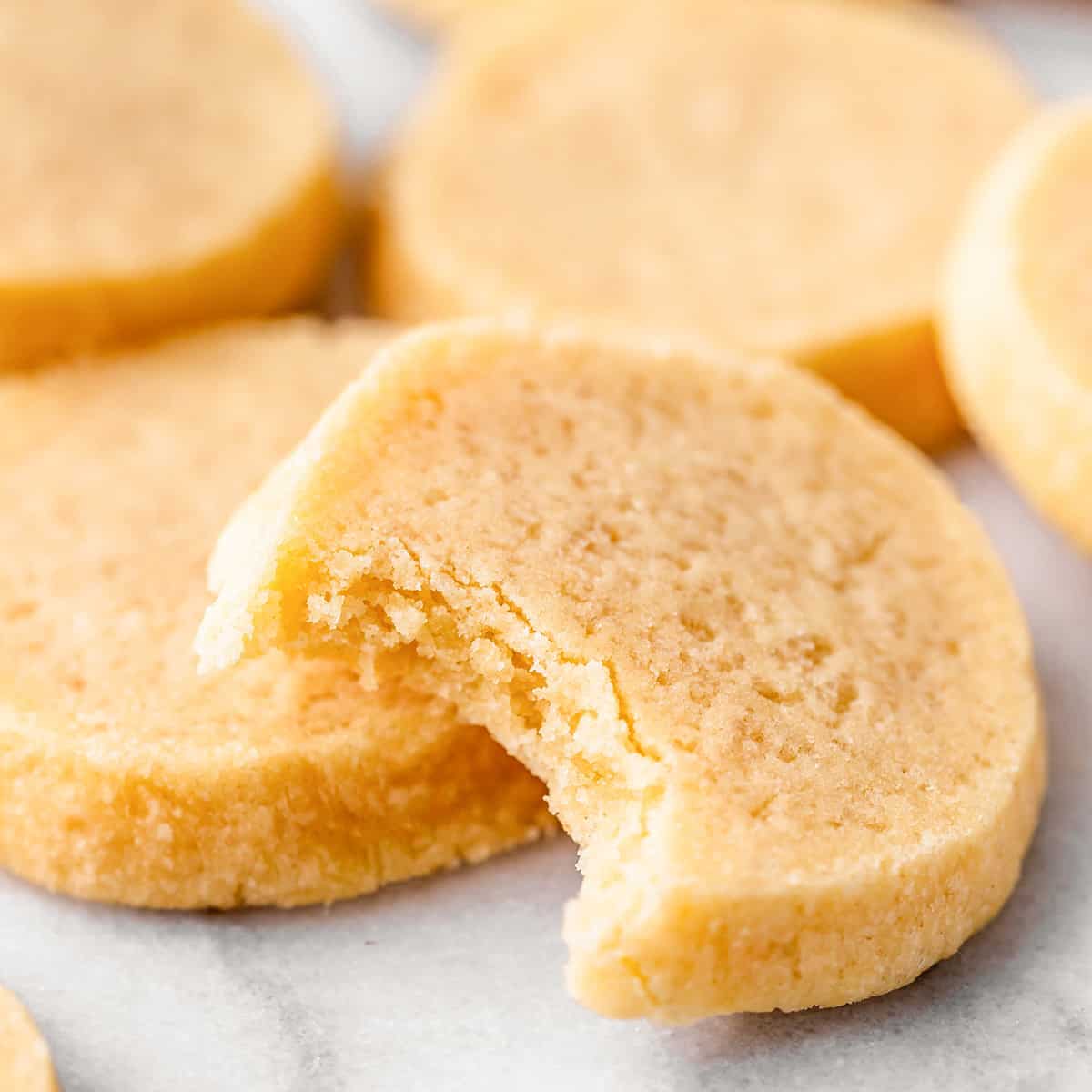 5 Shortbread Cookies, one with a bite taken out of it