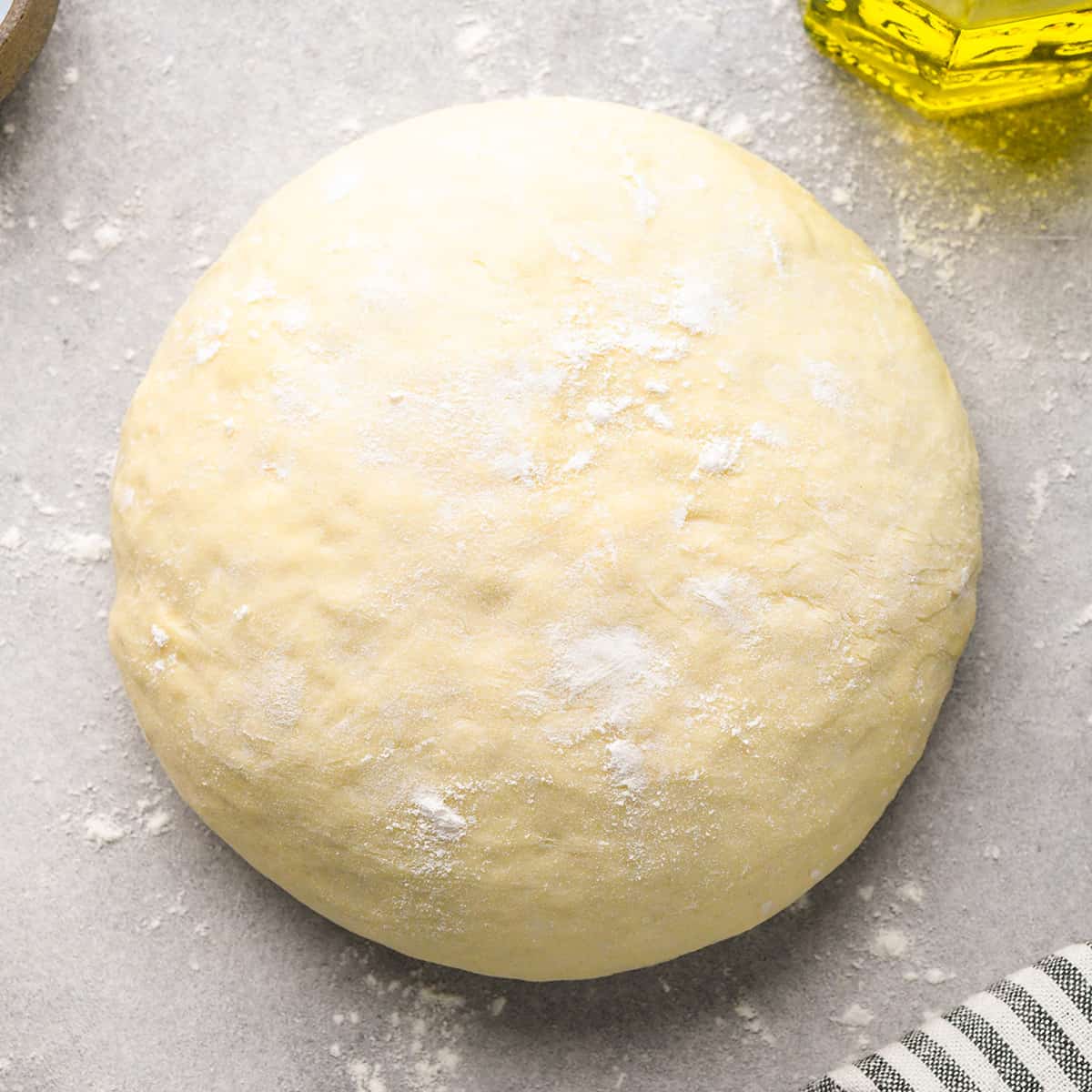 Homemade Pizza Dough Recipe after it has been kneaded and formed into a ball