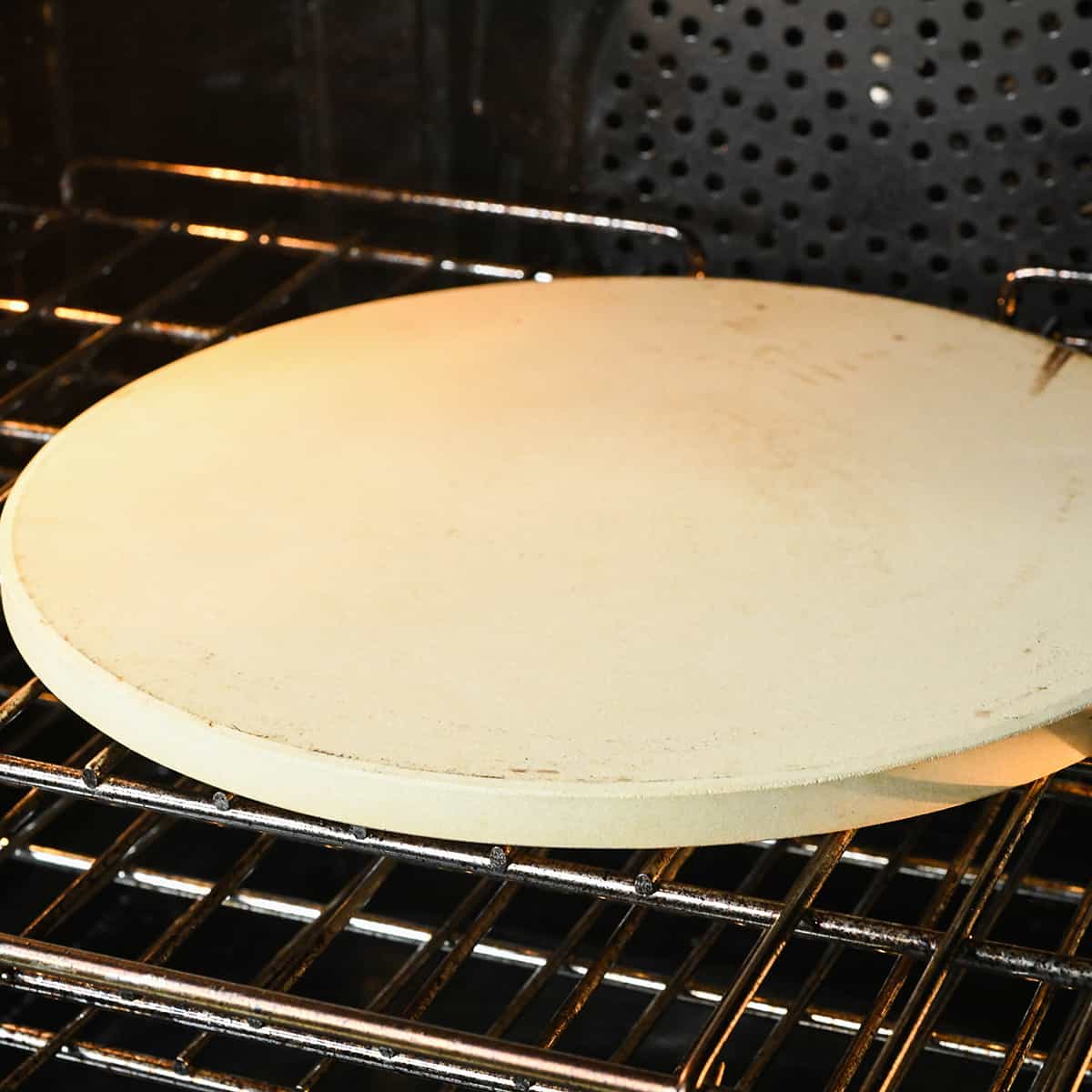 a pizza stone in an oven 