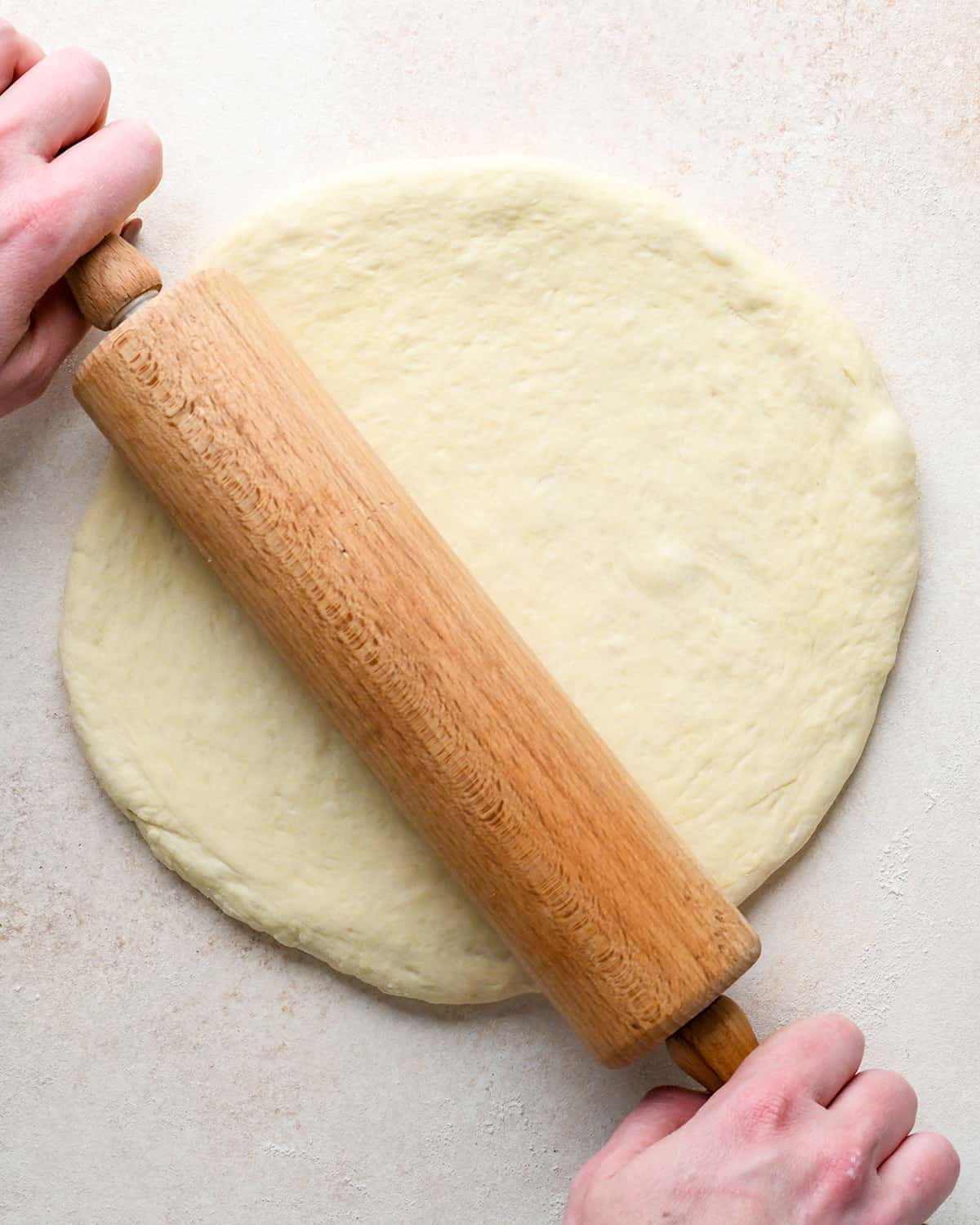 How to Make Pizza - rolling out pizza dough