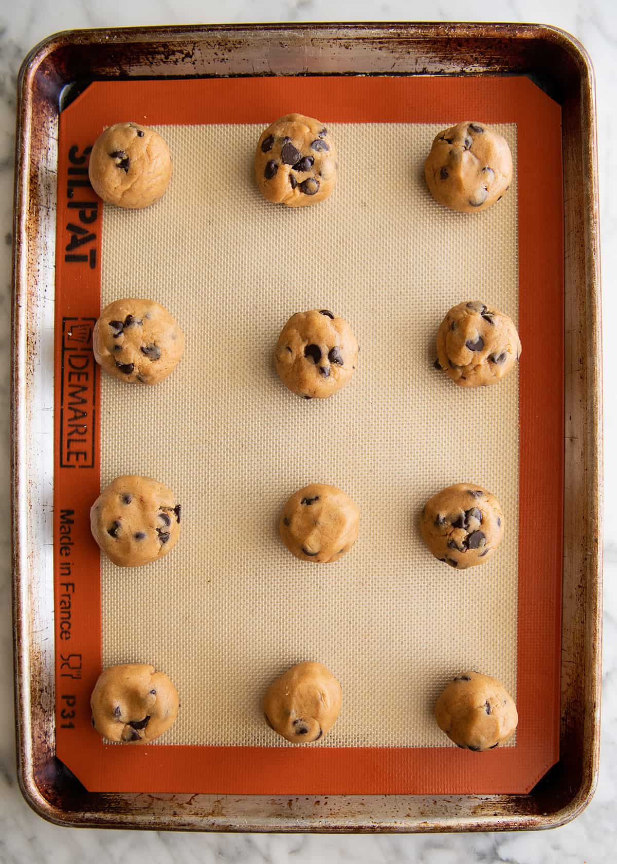 Peanut Butter Chocolate Chip Cookies on a baking sheet before being baked