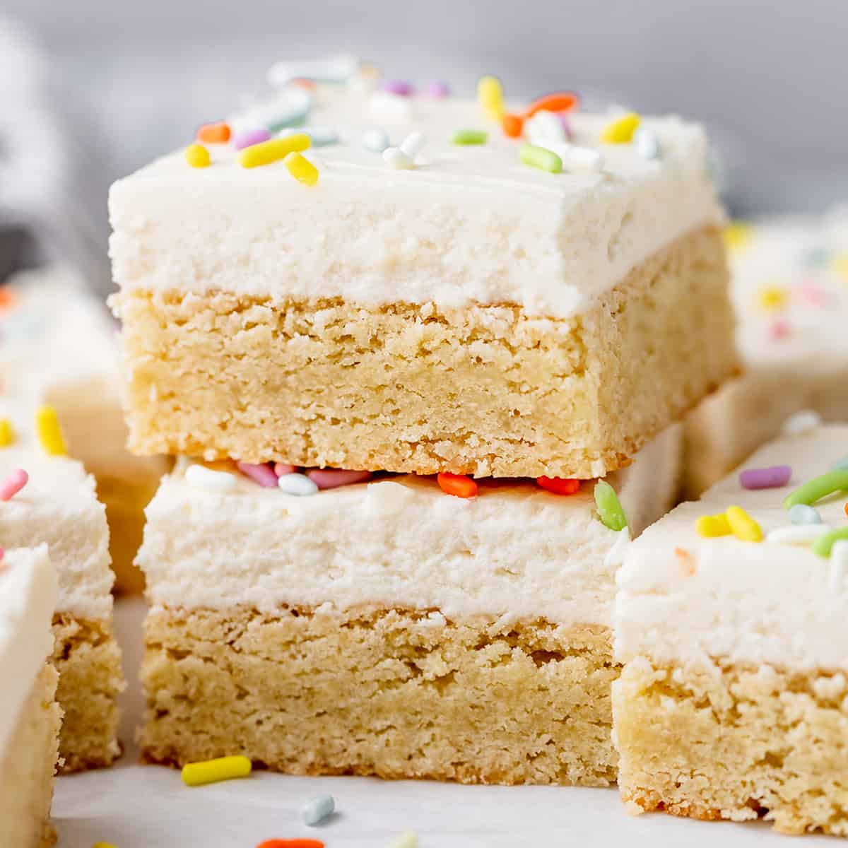 a stack of two Sugar Cookie Bars with frosting and sprinkles