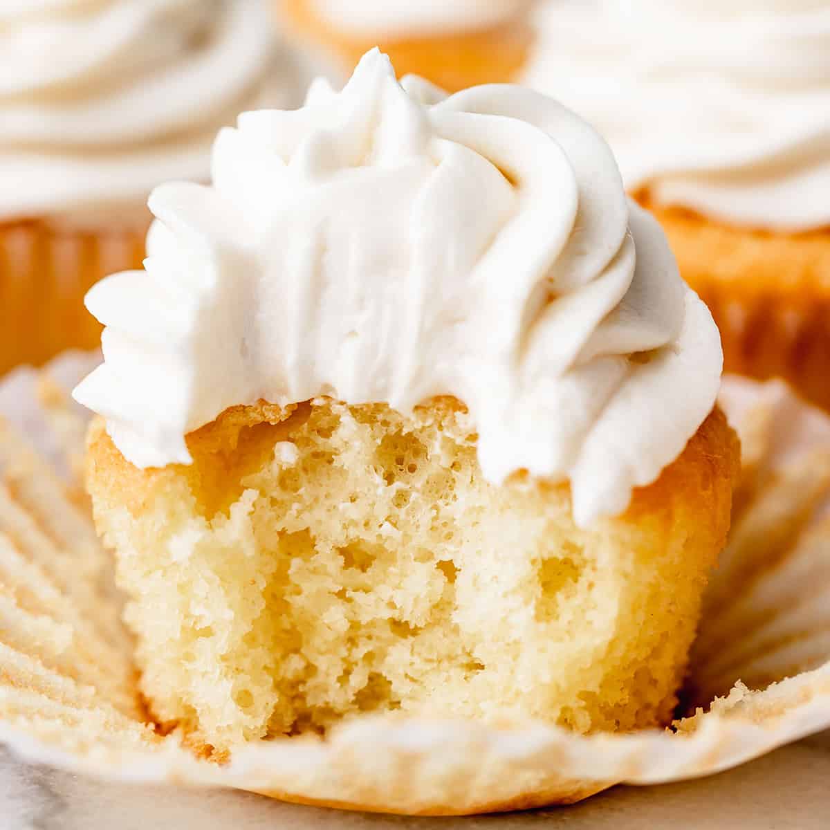 Vanilla Buttercream Frosting on a cupcake with a bite taken out of it