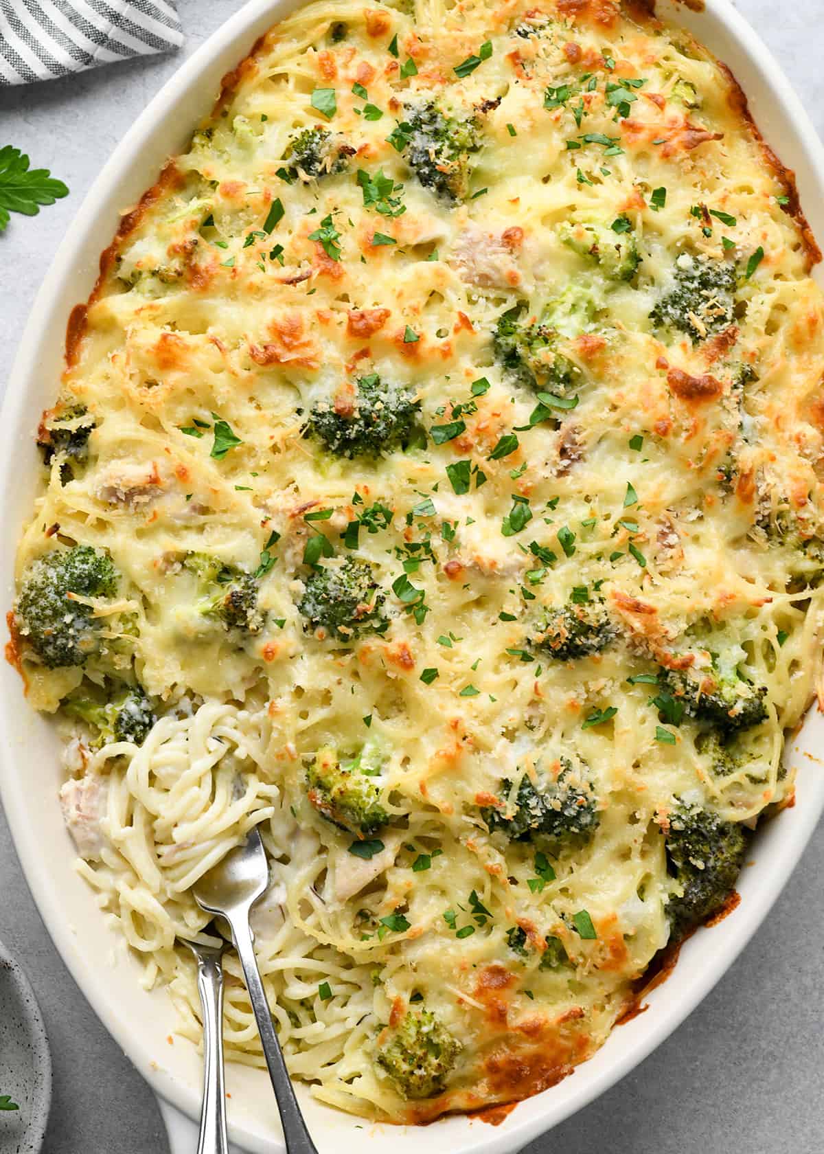 Chicken Tetrazzini in a baking dish with two forks
