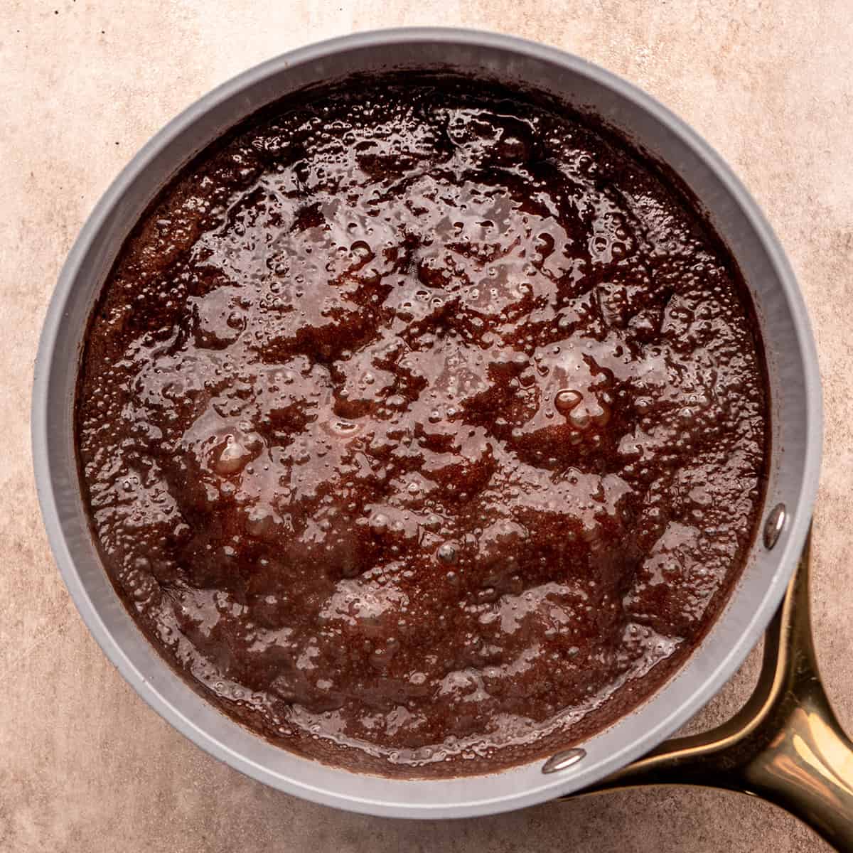 fudge mixture coming to a boiling in a saucepan