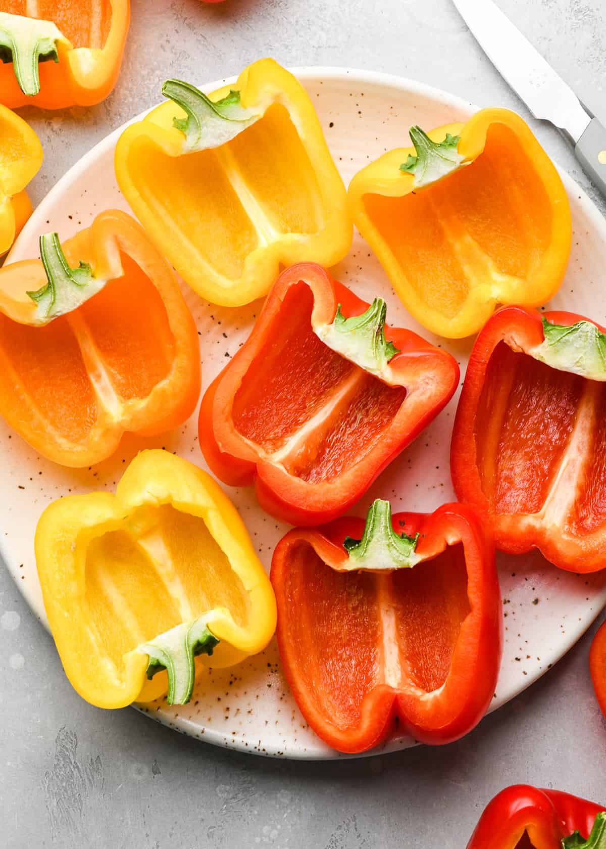 How to Make Stuffed Peppers - 9 bell pepper halves on a plate