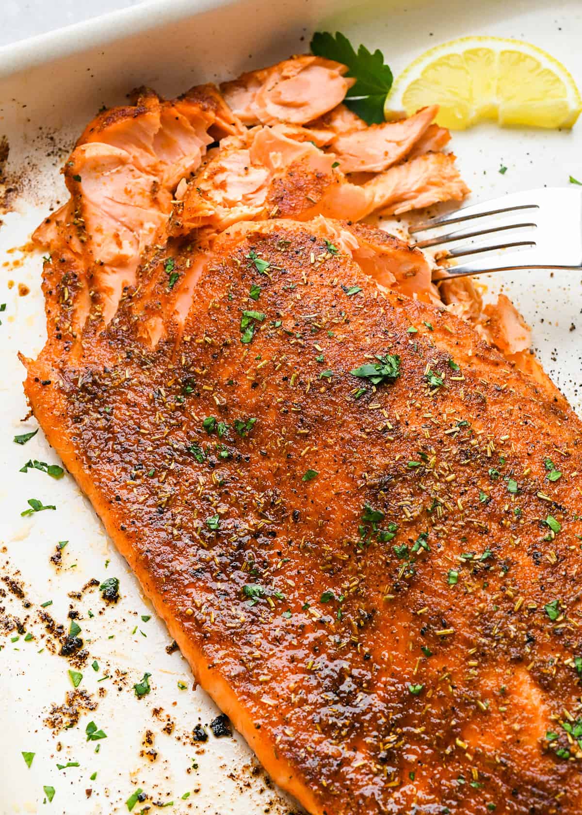 Oven Baked Salmon on the baking sheet with a fork