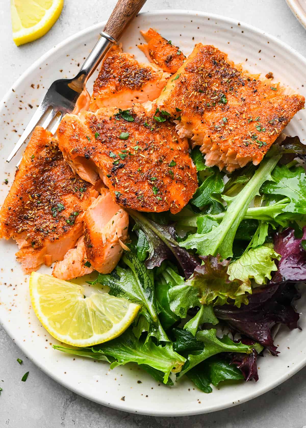 Oven Baked Salmon on a plate with salad