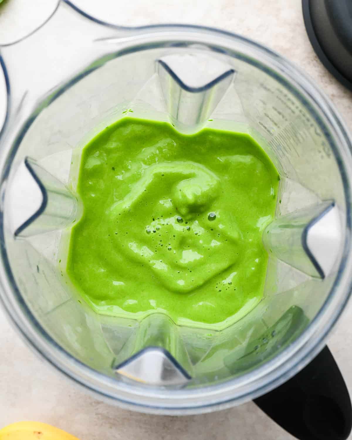 Spinach Smoothie in a blending container after blending