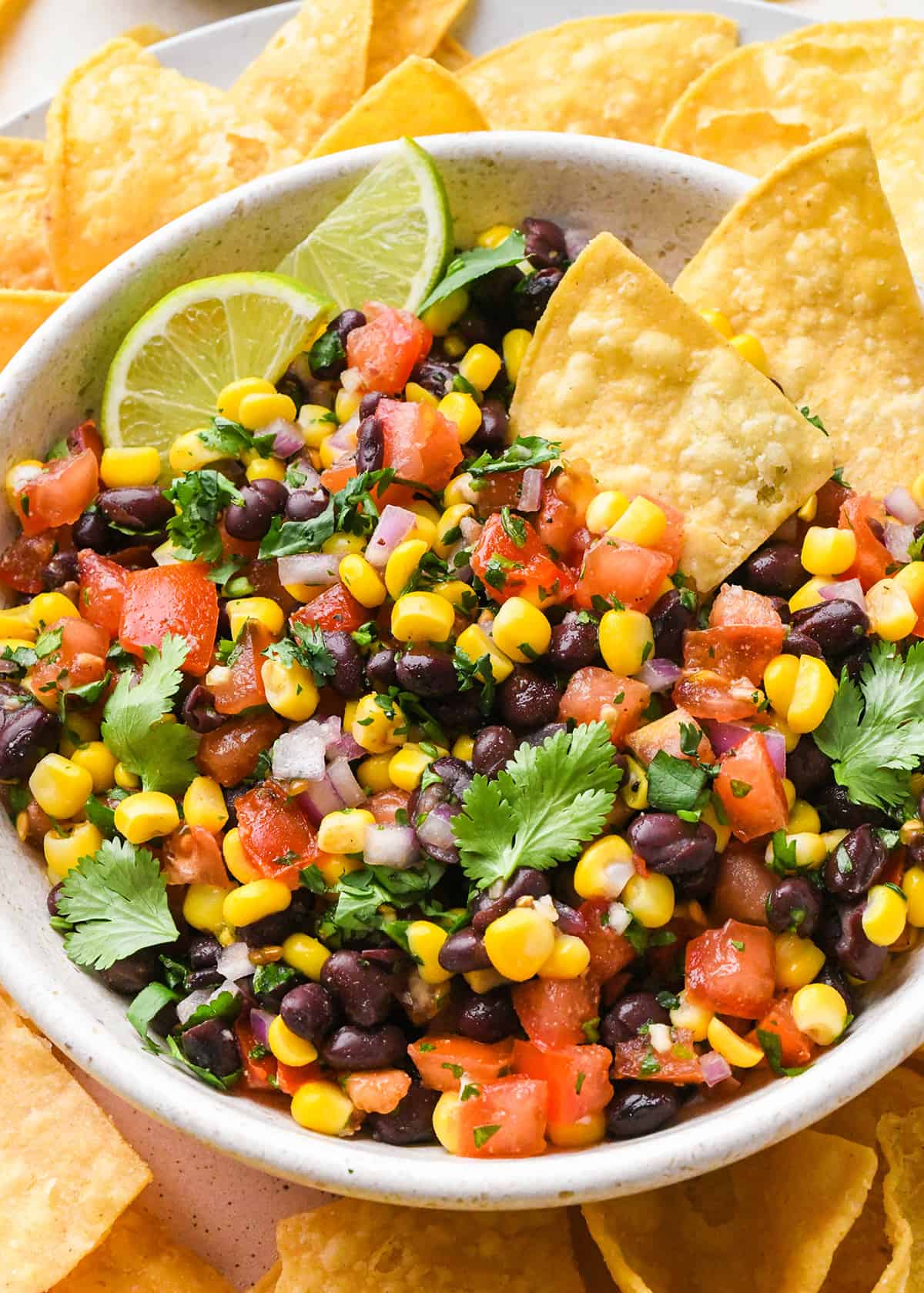 a bowl of Black Bean and Corn Salsa with chips