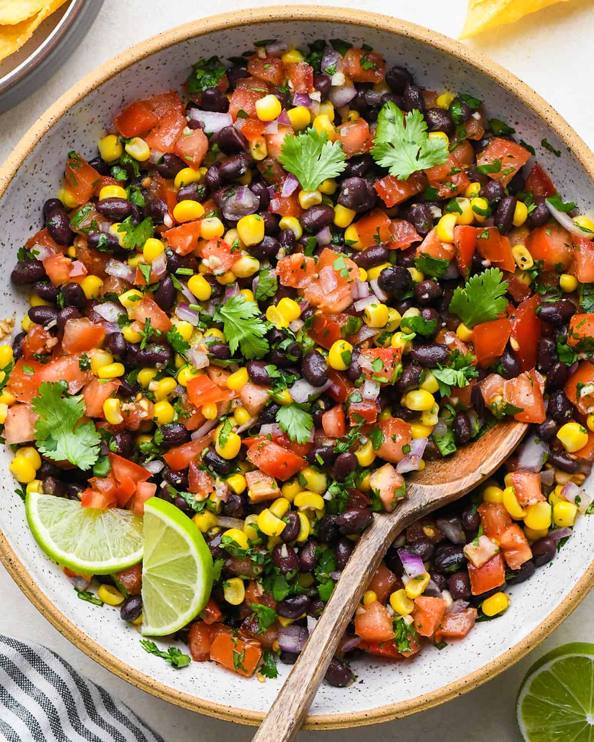 black bean corn salsa in a bowl garnished with cilantro