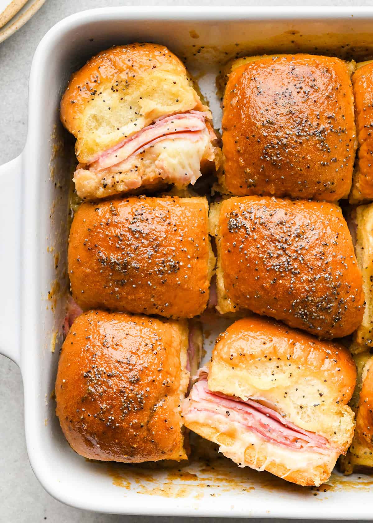 6 Ham and Cheese Sliders in a baking dish