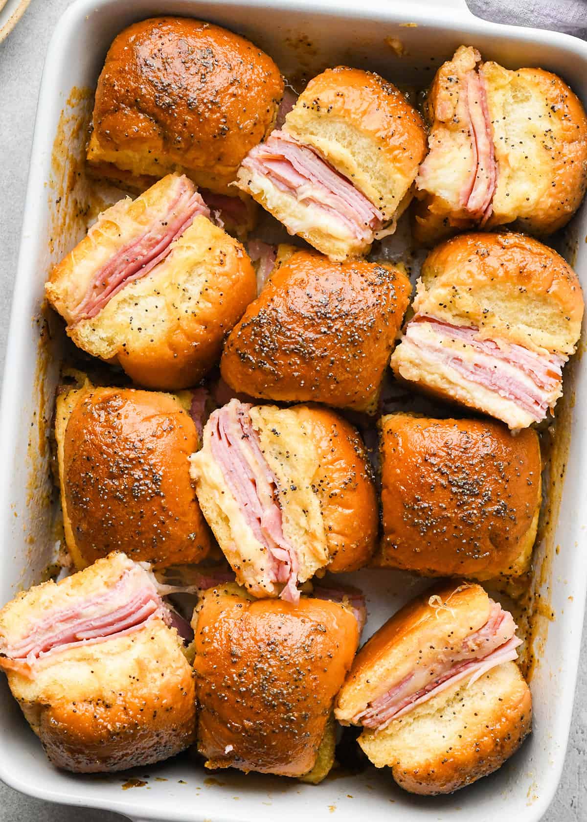 12 Ham and Cheese Sliders in a baking dish