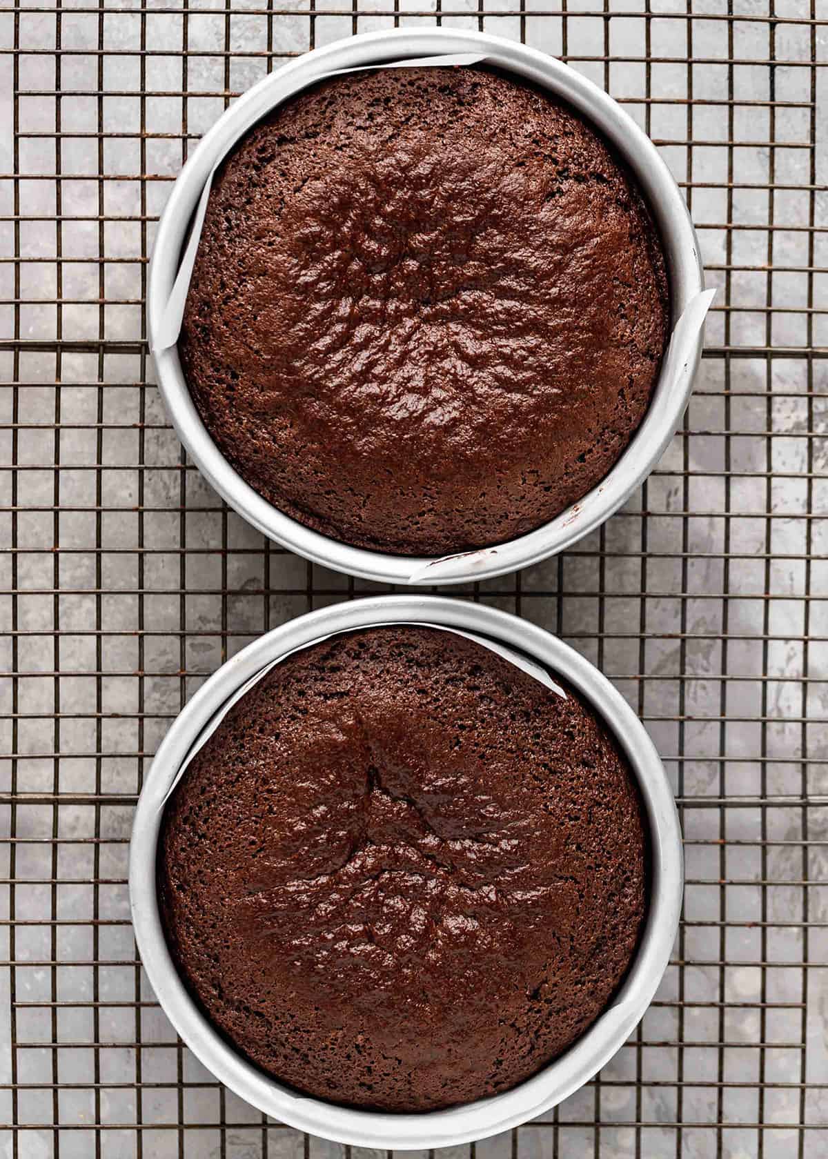 chocolate cake baked in two 6" round cake pans on a wire cooling rack
