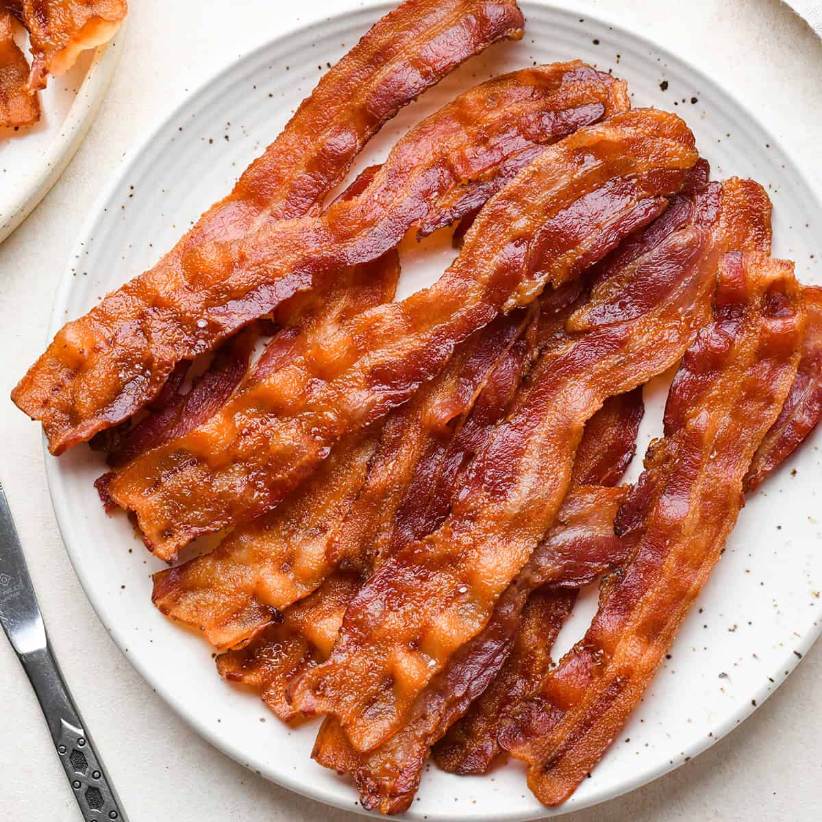 10 slices of Oven Baked Bacon on a plate
