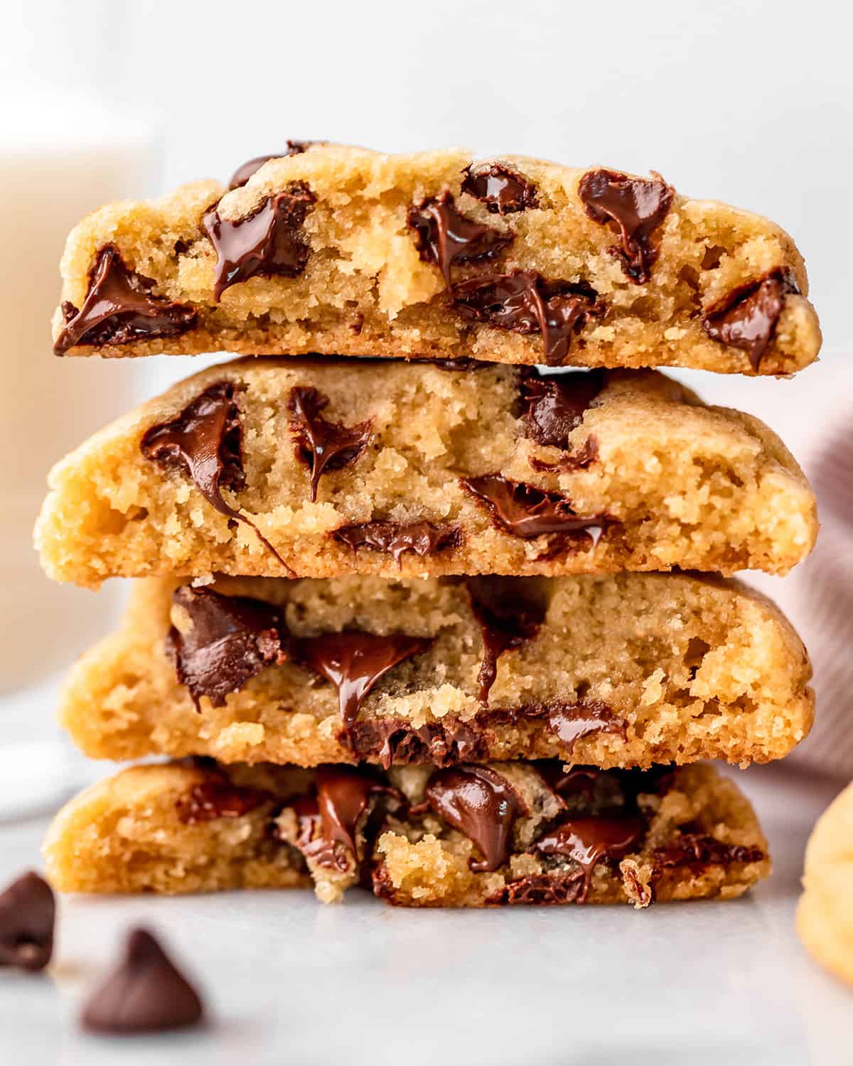 a stack of 4 Small Batch Chocolate Chip Cookies cut in half so you can see the texture inside