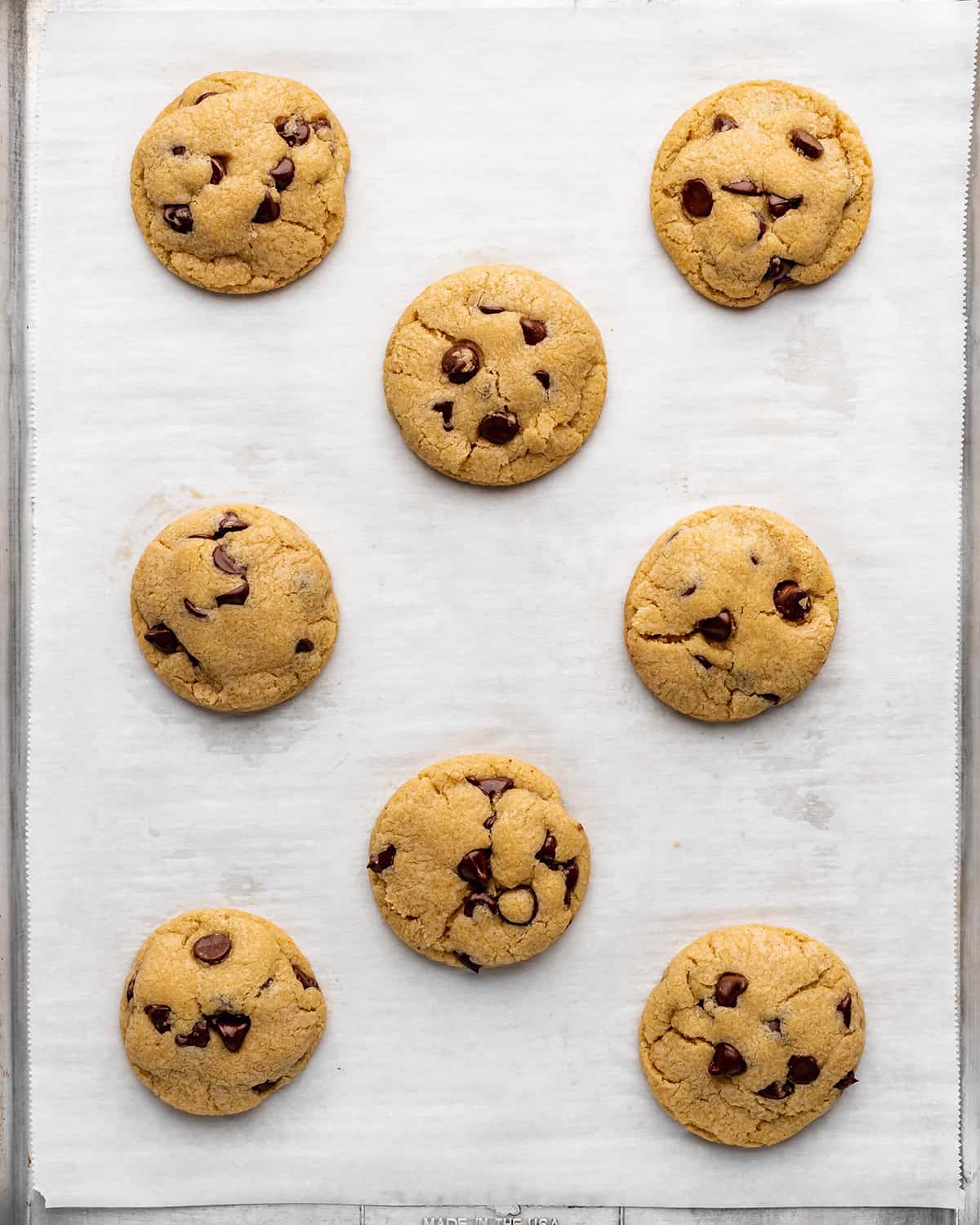 8 Small Batch Chocolate Chip Cookies on a baking sheet after baking
