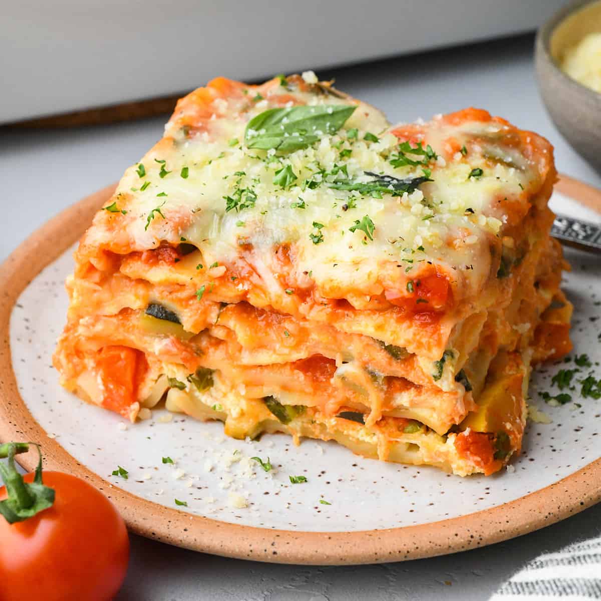 a piece of Vegetable Lasagna on a plate