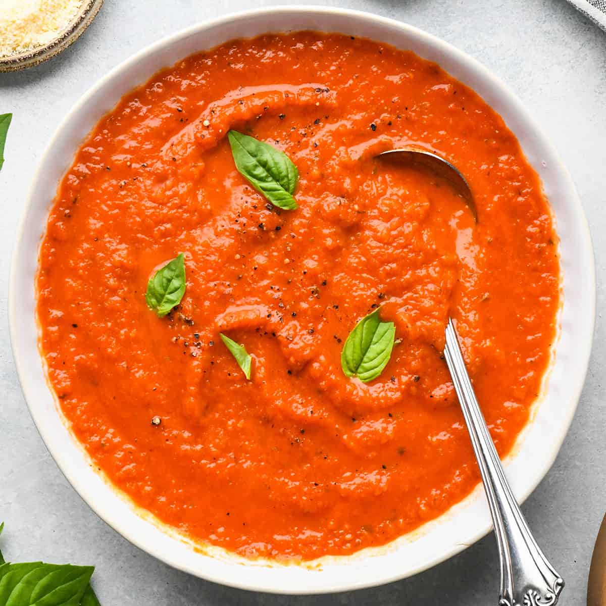 a bowl of Homemade Marinara Sauce with basil and pepper