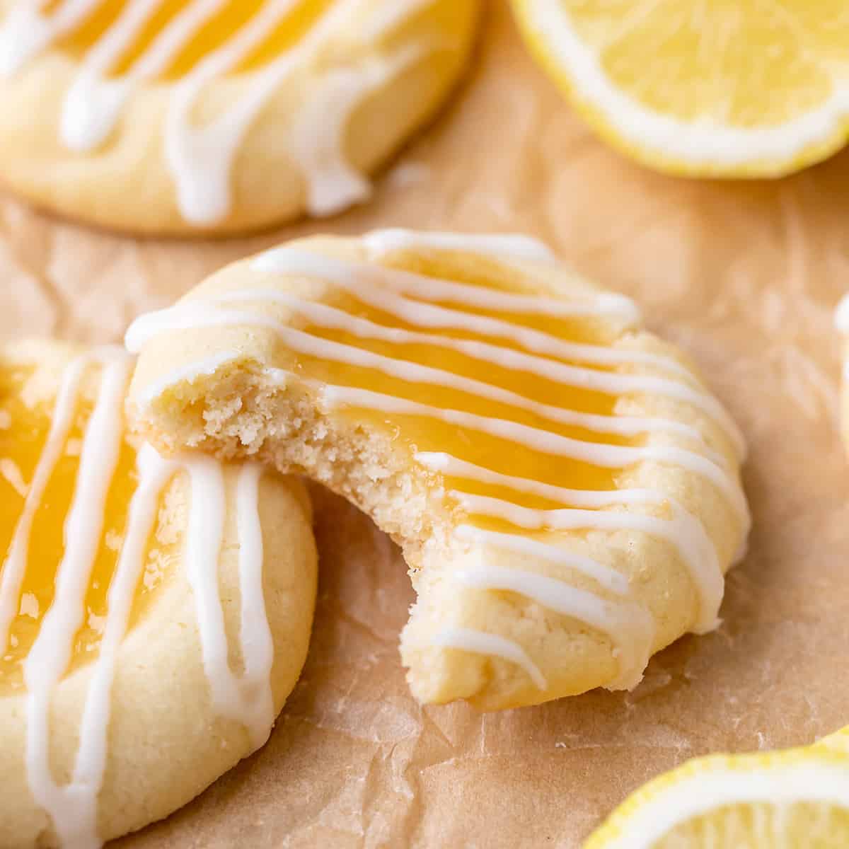 glazed Lemon Curd Cookies, one with a bite taken out of it