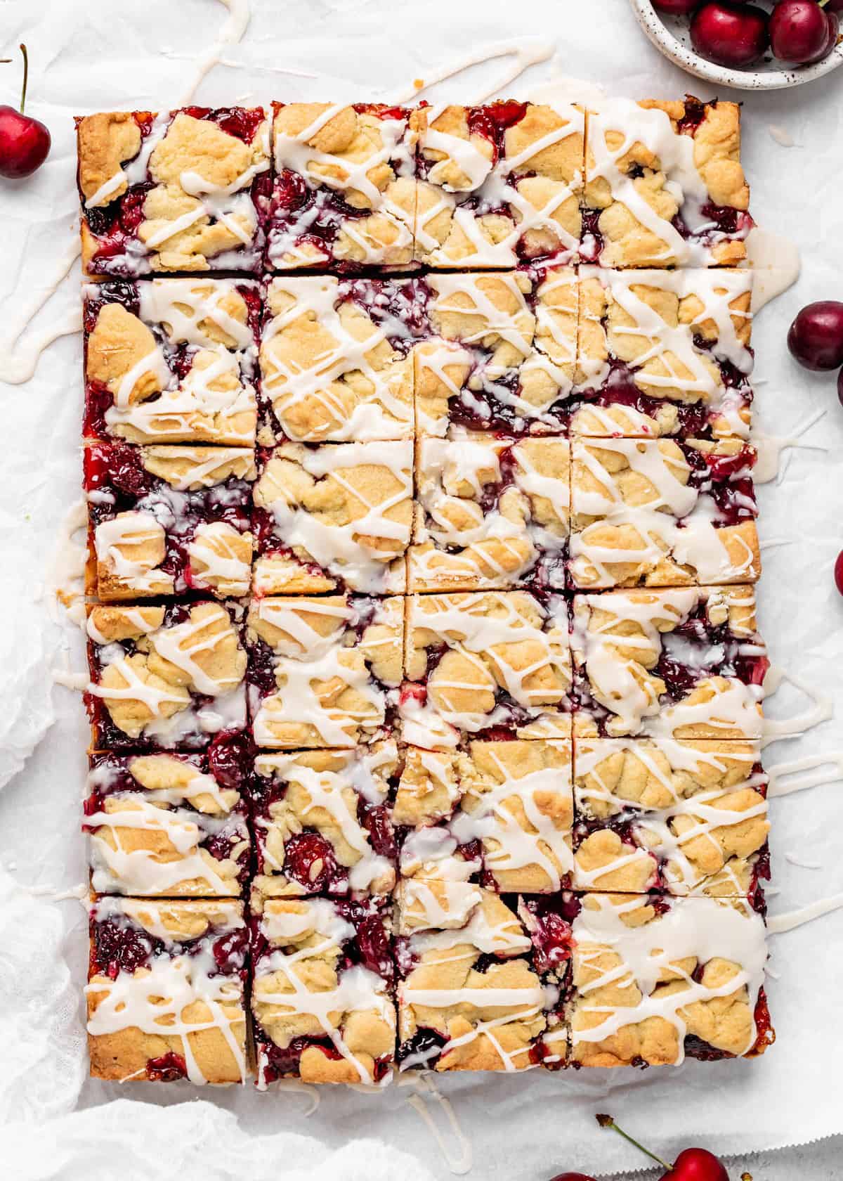 glazed cherry pie bars cut into 24 squares